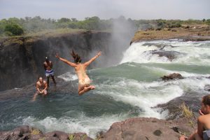 girl jumping into devil's pool zambia