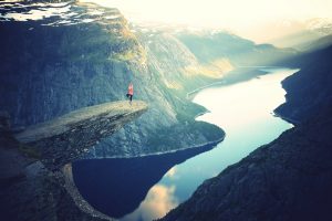 Trolltunga rock Norway yoga pose